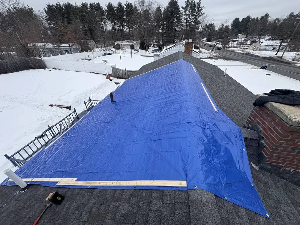 A-Z Roofing emergency tarping on a leaking roof