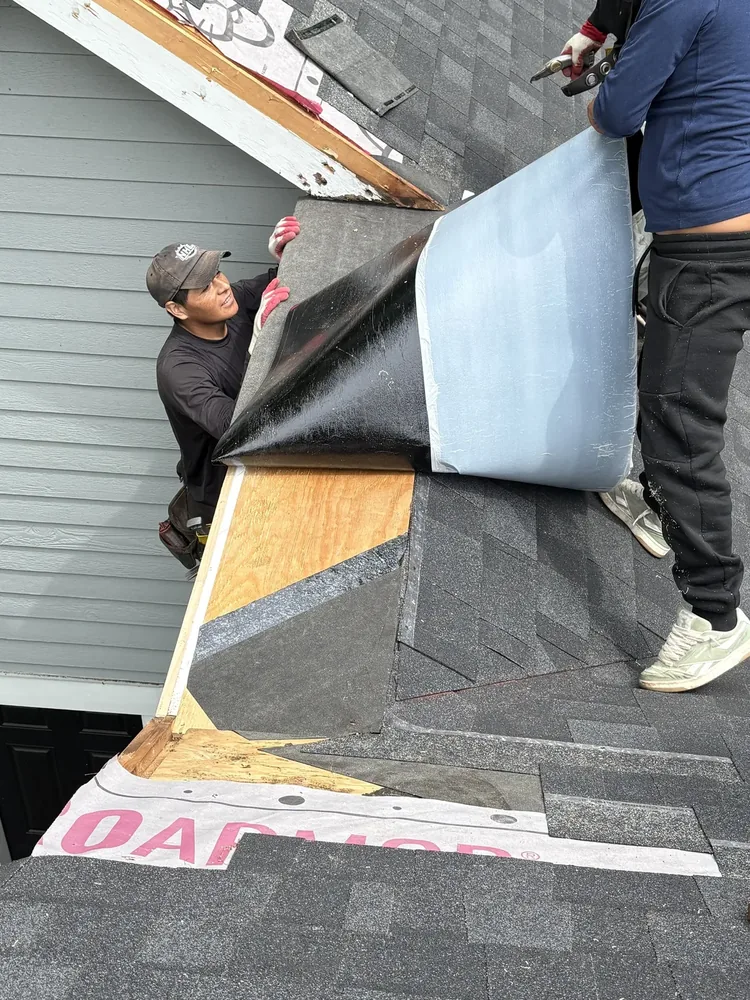 A-Z Roofing crew repairing a damaged roof