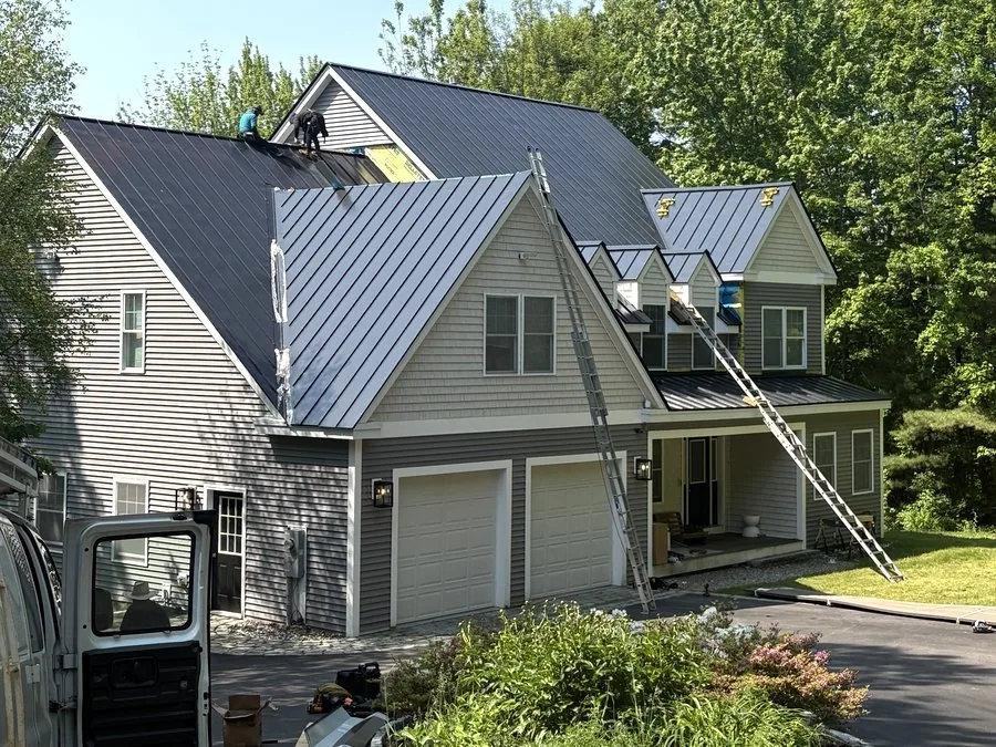 A-Z Roofing crew installing a standing seam metal roof