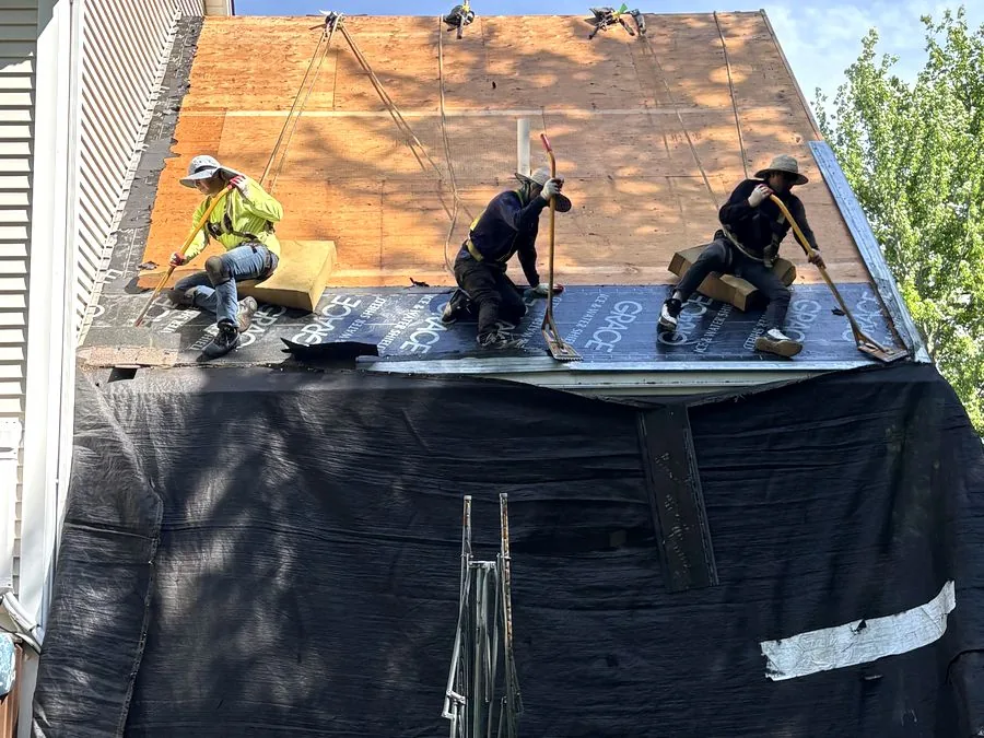 A-Z Roofing crew installing a full roof replacement